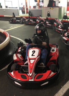 One of Xfive's developers is driving a go-kart.