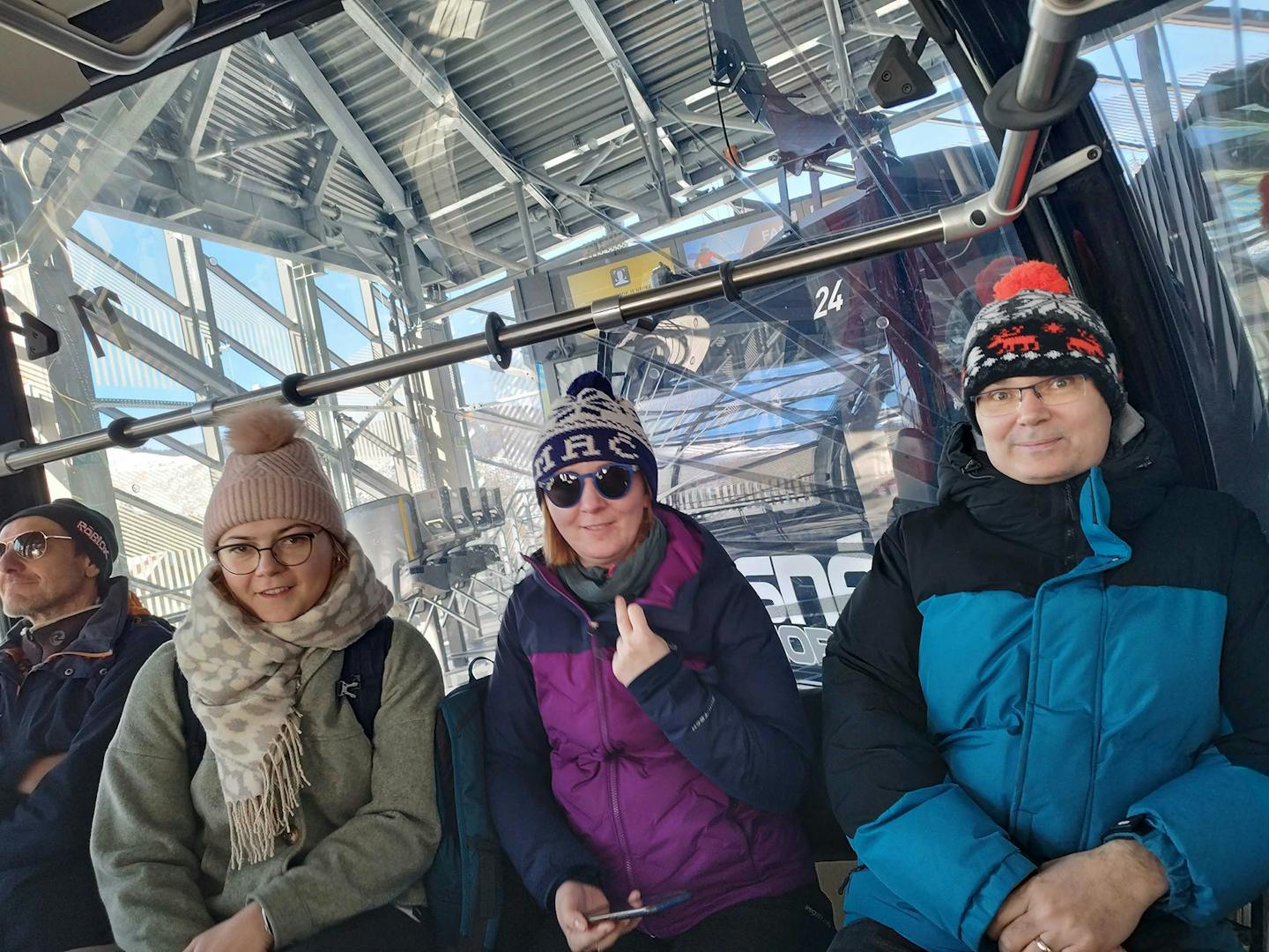 Three members of the Xfive team on a ski lift during the company's ski weekend.