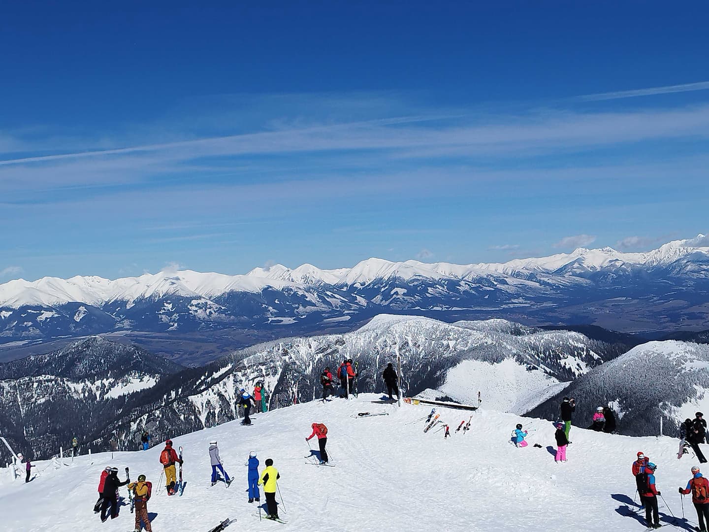 A view of a ski slope and Xfive team members skiing.